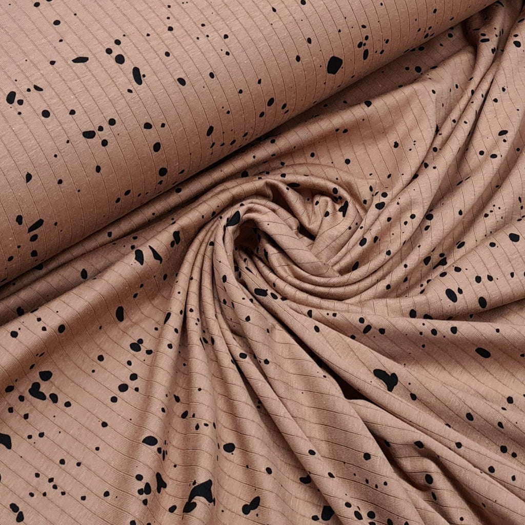 Black Splashes print on light brown ribbed jersey, very soft lightweight fabtic  Perfect for tops, dresses, leggings, blankets, bibs, pyjamas and more  150cm wide   97% Cotton, 3% Lycra